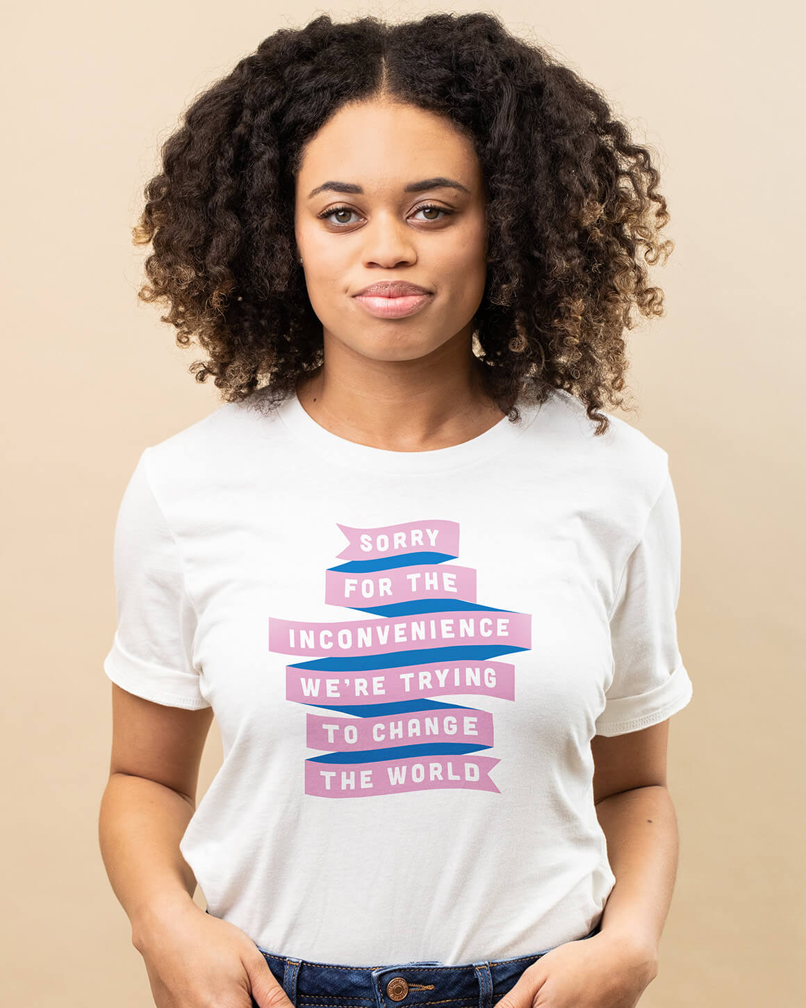 Smiling woman wearing a premium white t-shirt with two color feminist design