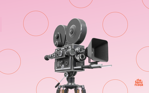 Documentary film camera on pink background with The Feminista logo 