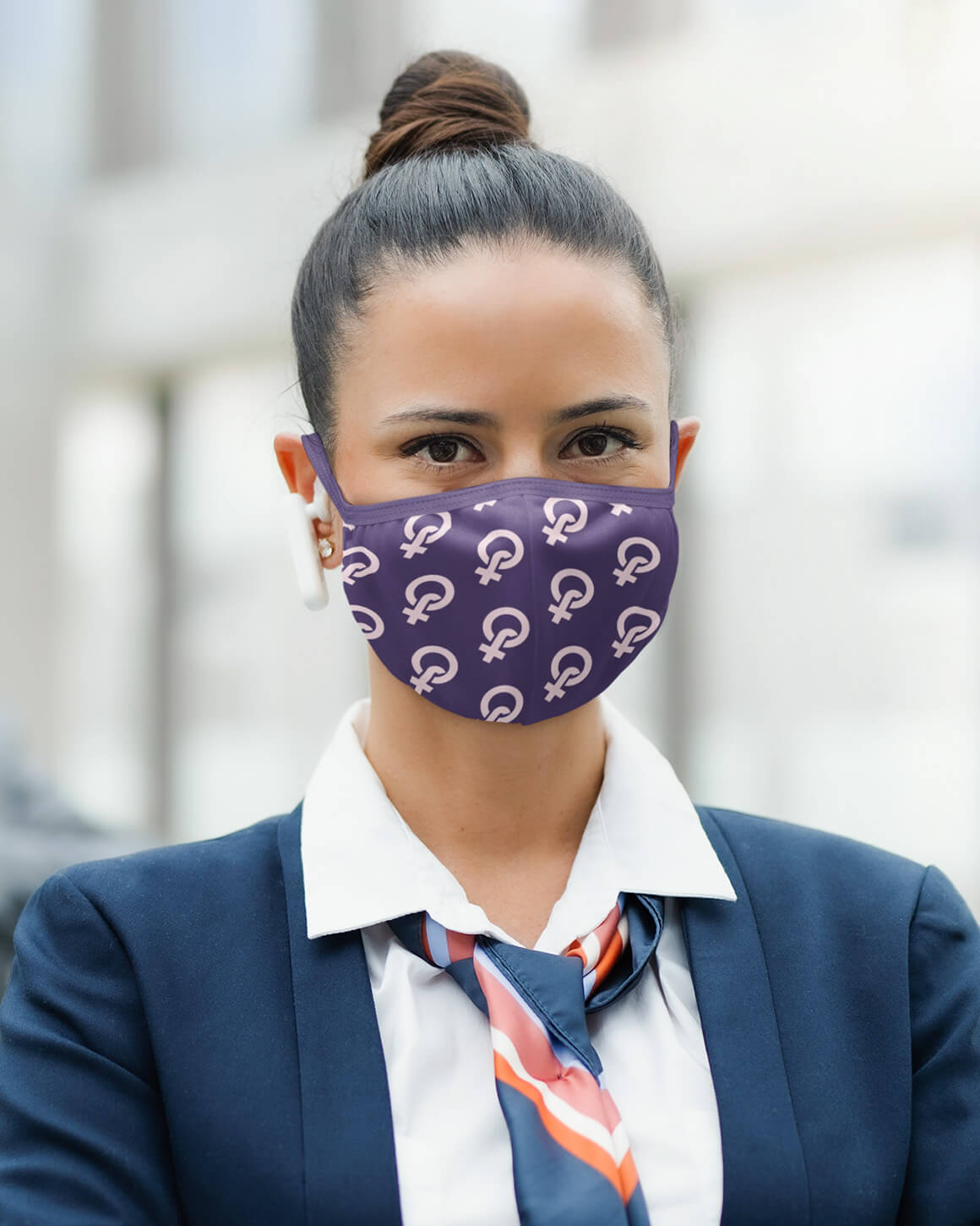 Woman wearing purple feminist face cover