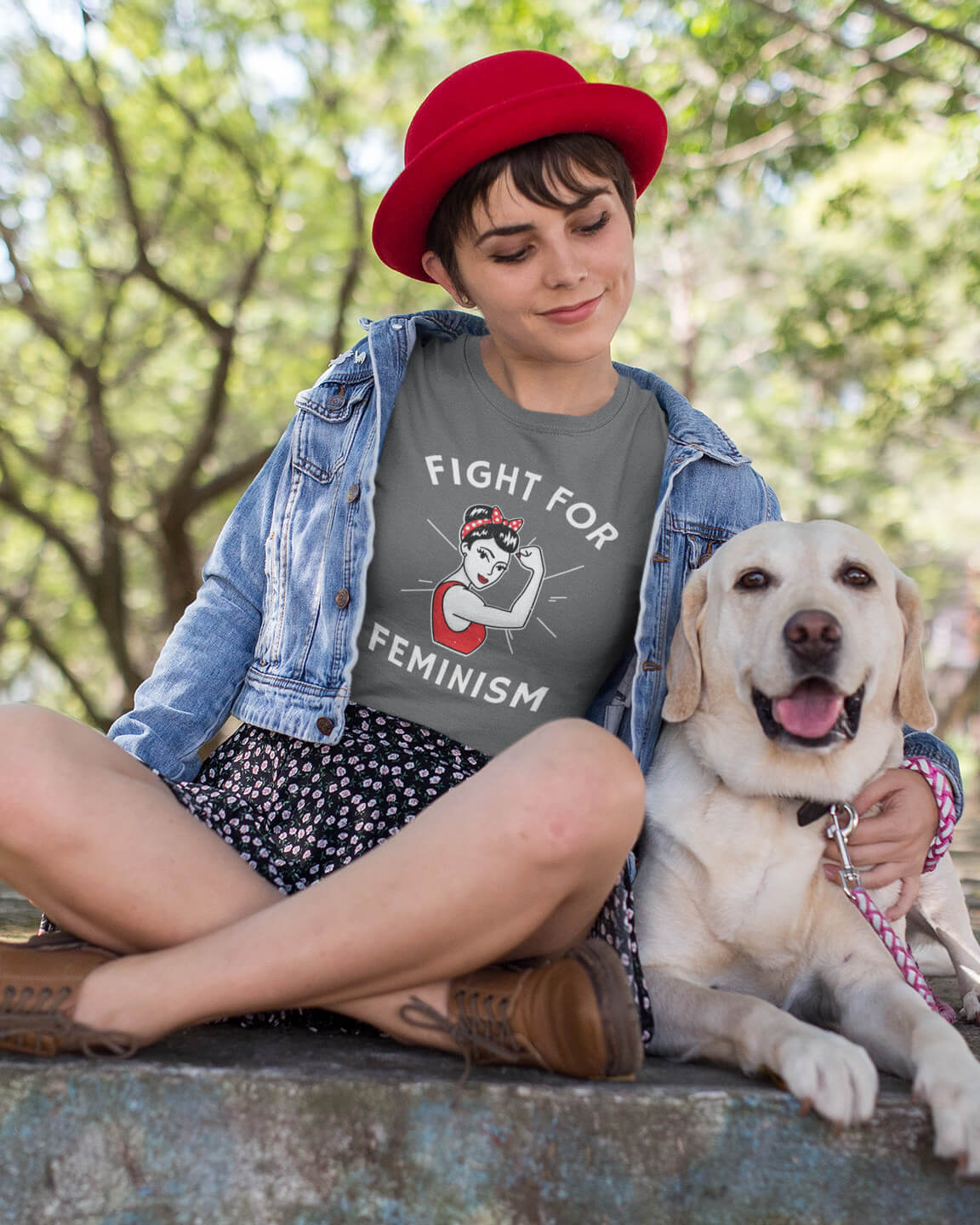 Woman petting her dog wearing Fight For Feminism shirt