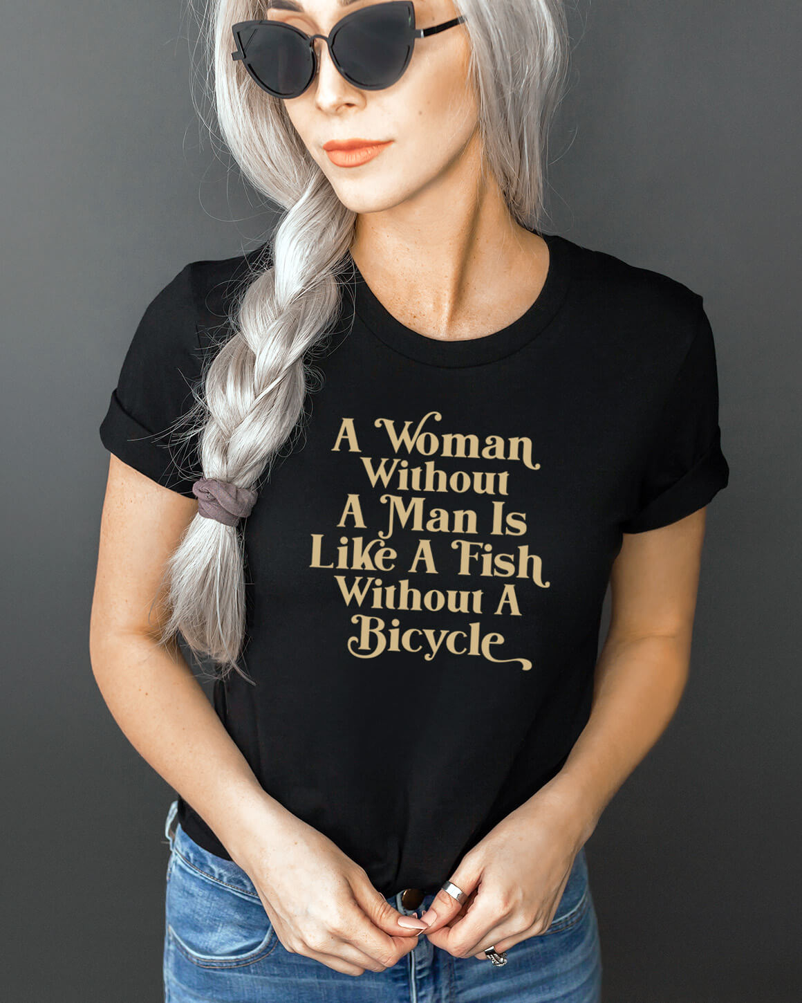 Women in black sunglasses and jeans wearing a funny feminist t-shirt