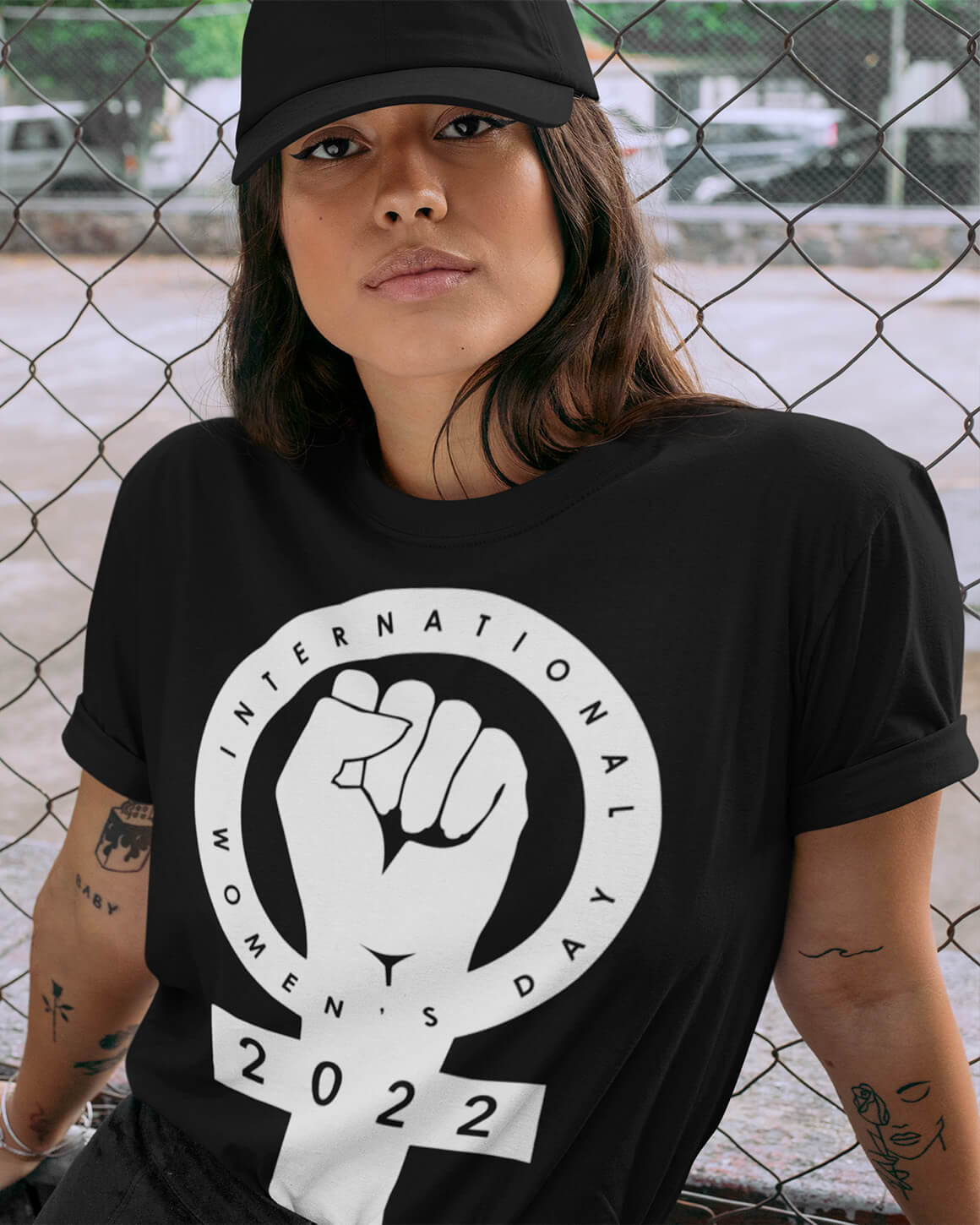 Cozy black t-shirt with a venus symbol and a raised fist for feminism