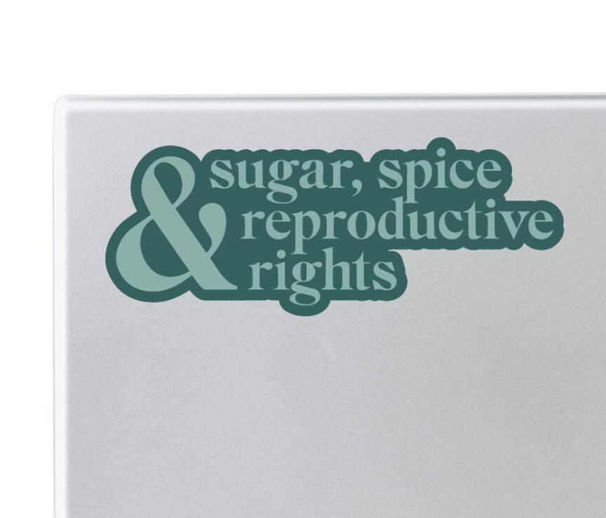 Close up of laptop with green pro choice sugar, spice and reproductive rights sticker