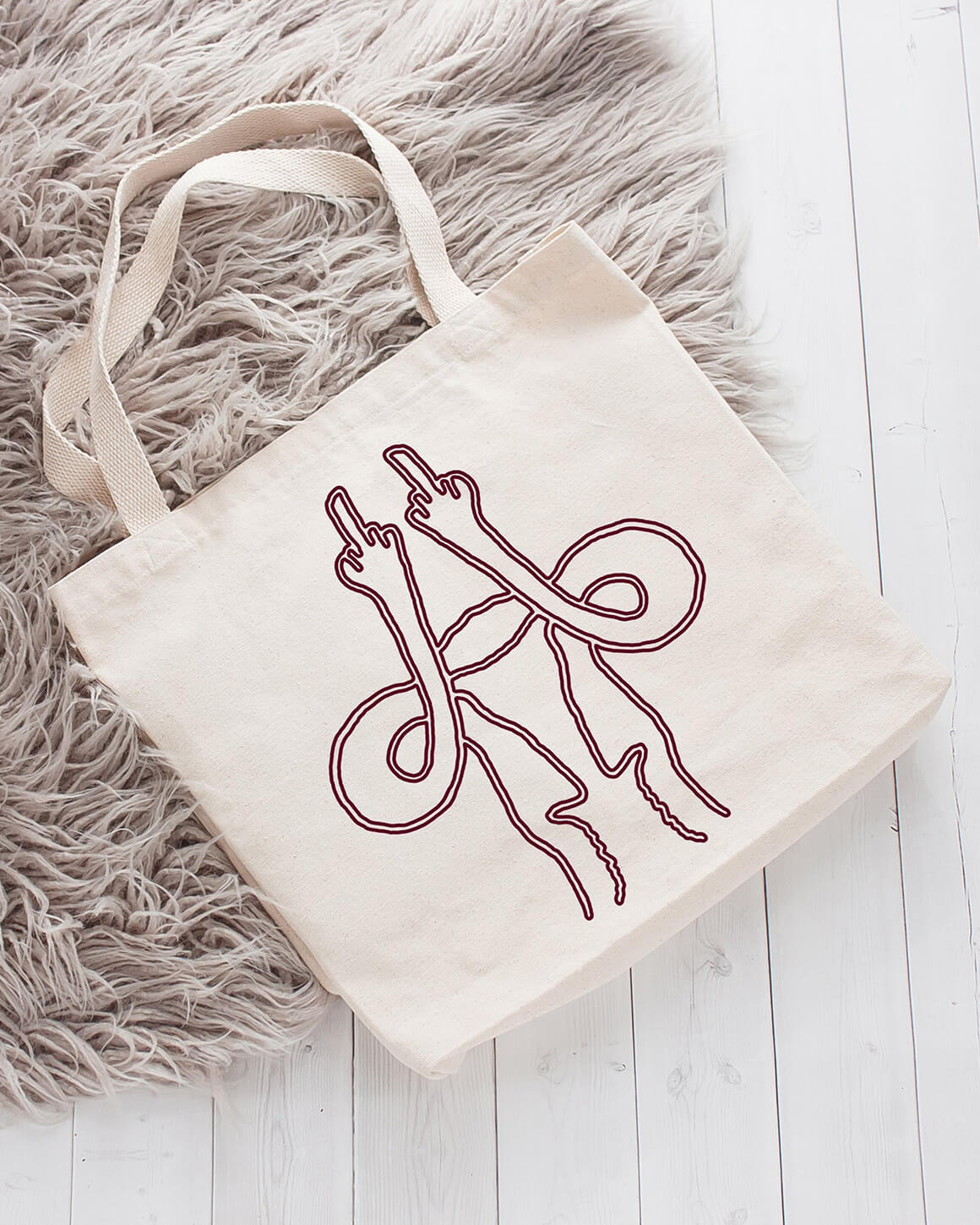 Cotton tote bag with a uterus giving the middle finger design
