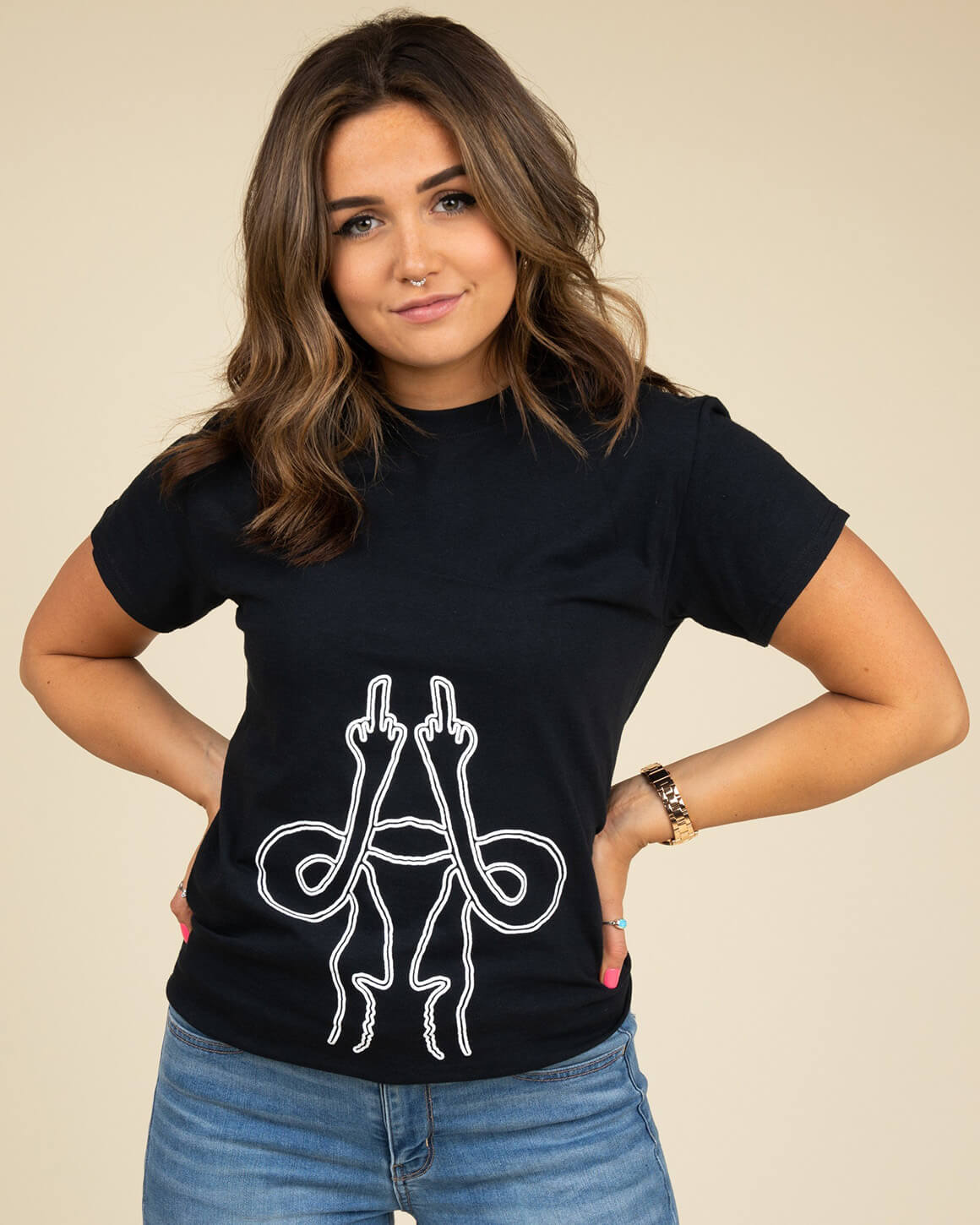 Girl with hands on hips wearing black uterus middle finger shirt