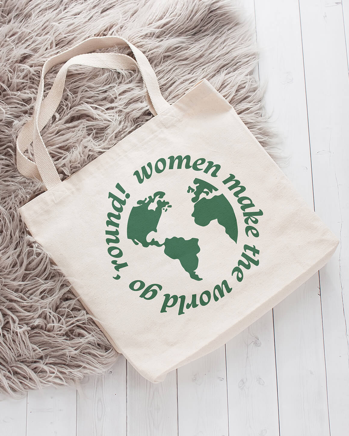 Natural cotton tote with feminist message printed in green